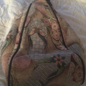 Danny K Beverly Hills country core tapestry triangle backpack in a beach scene